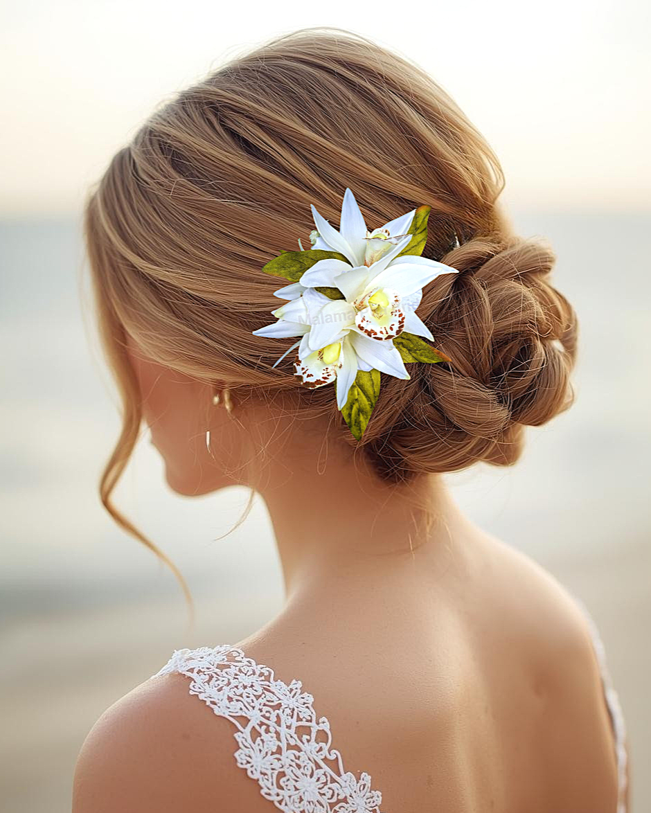 bride wearing tropical silk orchid wedding hair accessory