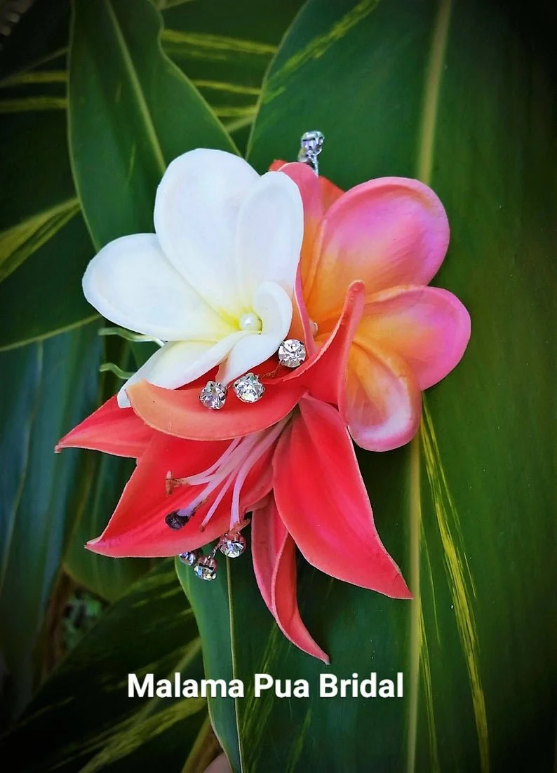 coral lily and plumeria flower comb