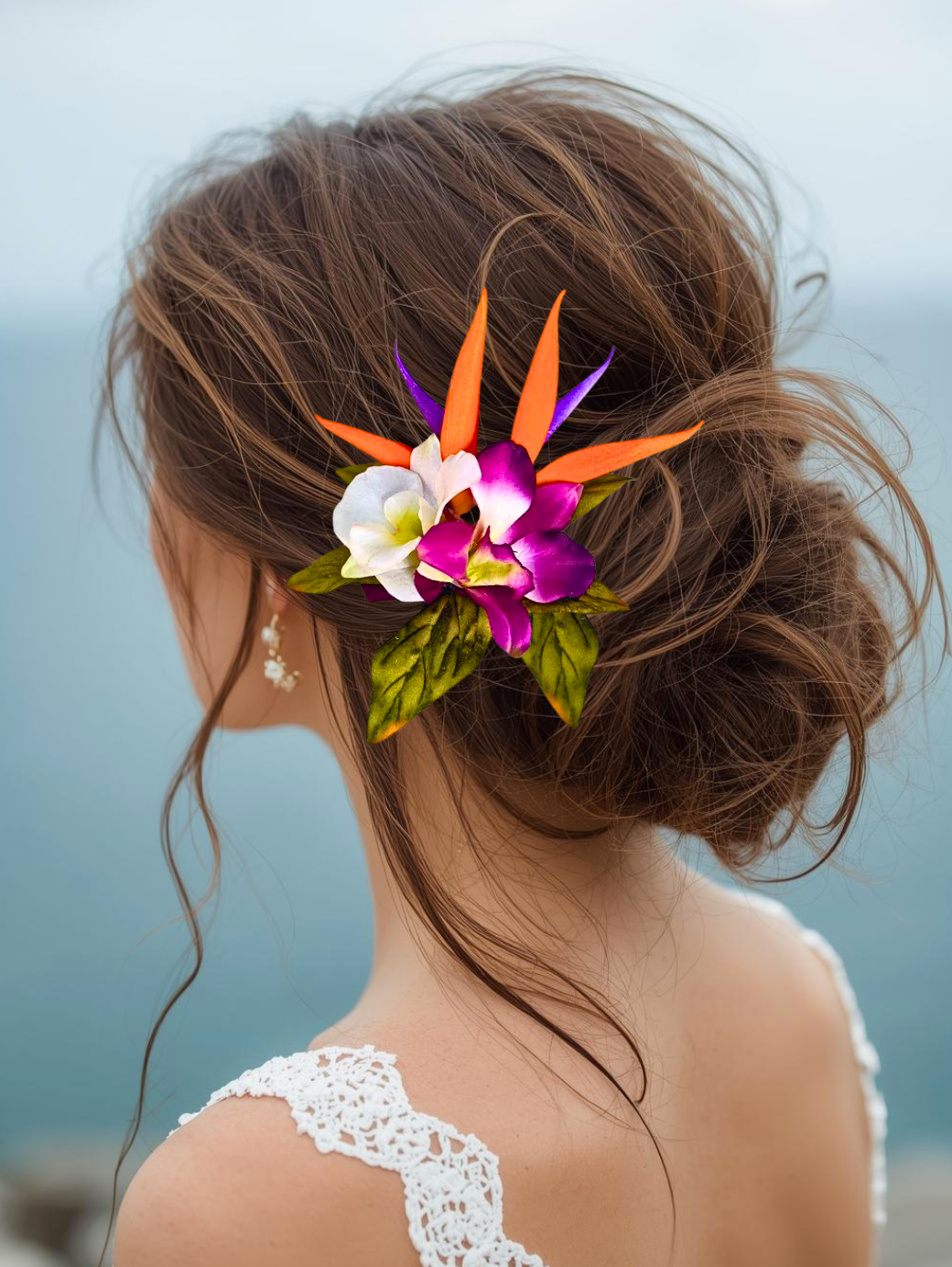 bride wearing a Tropical silk wedding headpiece with bird of paradise and orchids