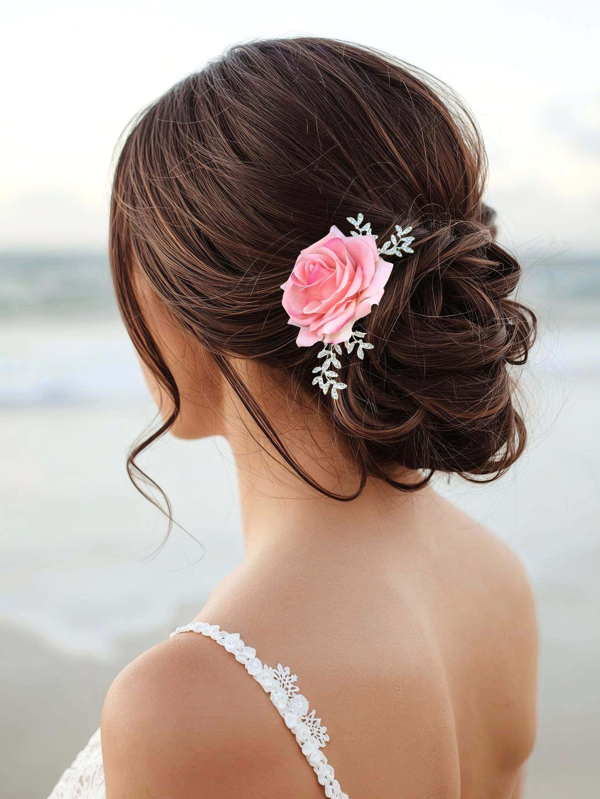 Bride wearing silk pink rose hair comb