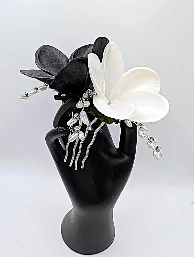 white and black plumeria comb