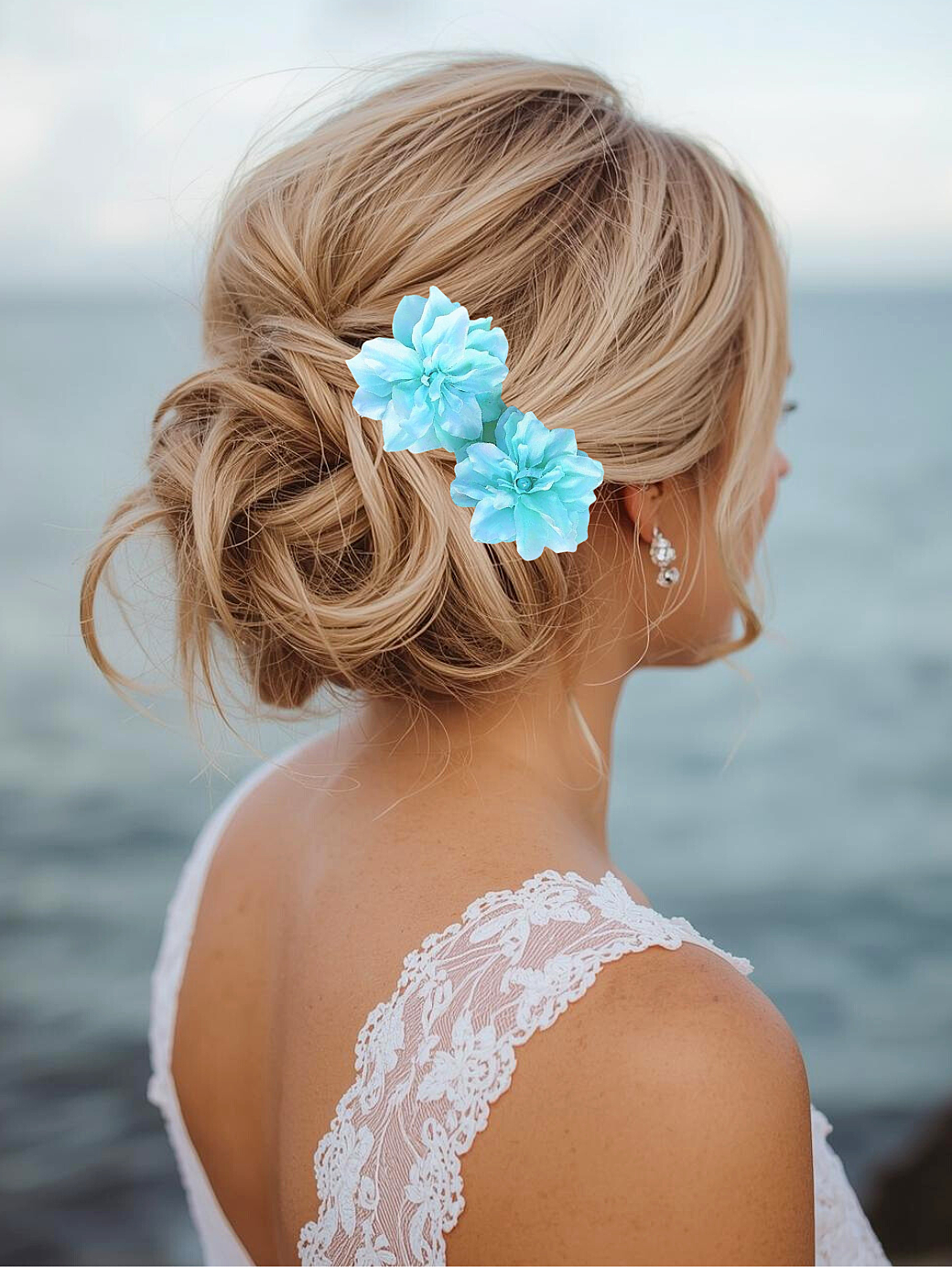 bride on beach wearing silk blue delphinium hair flowers with pearl (Copy)