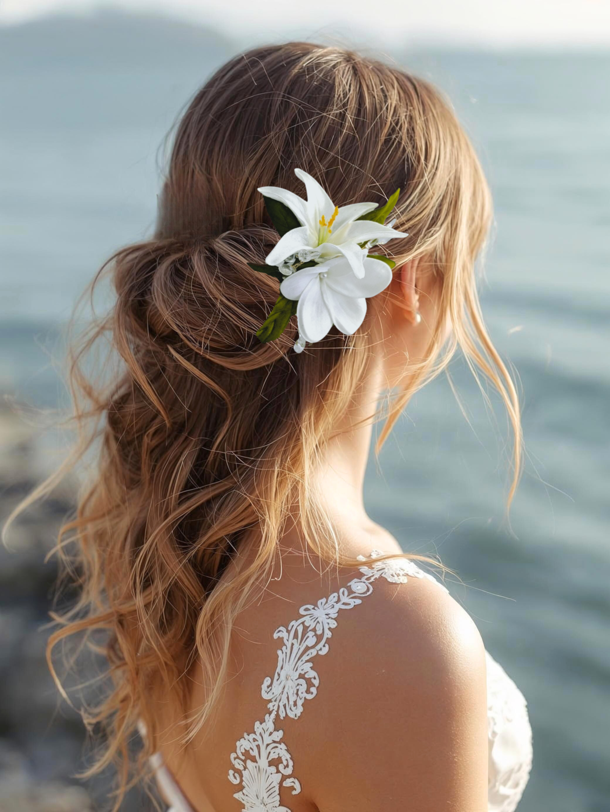 bride at beach wearing a small silk white lily and plumeria