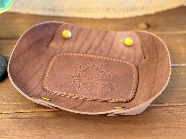 Handcrafted leather valet tray with stitched edges, perfect for holding keys, coins, and everyday essentials.