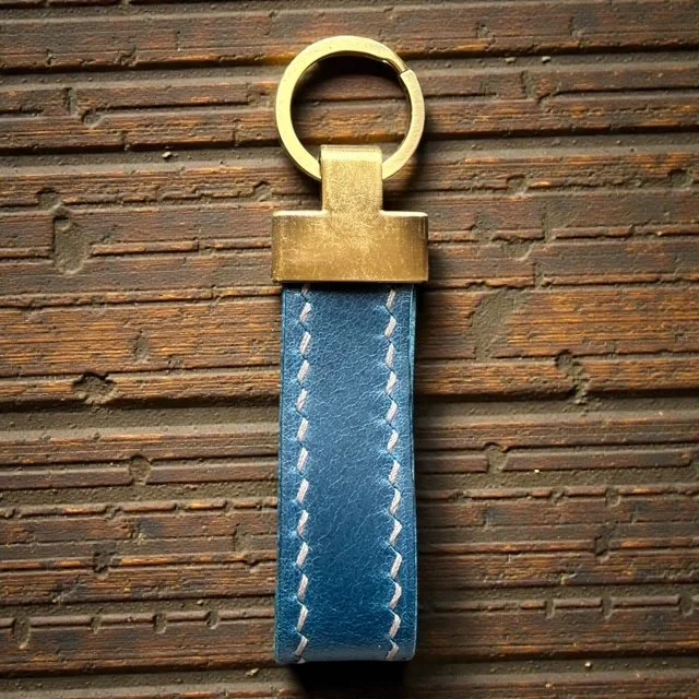 Handcrafted leather key loop for holding multiple keys securely, with simple and sleek design.