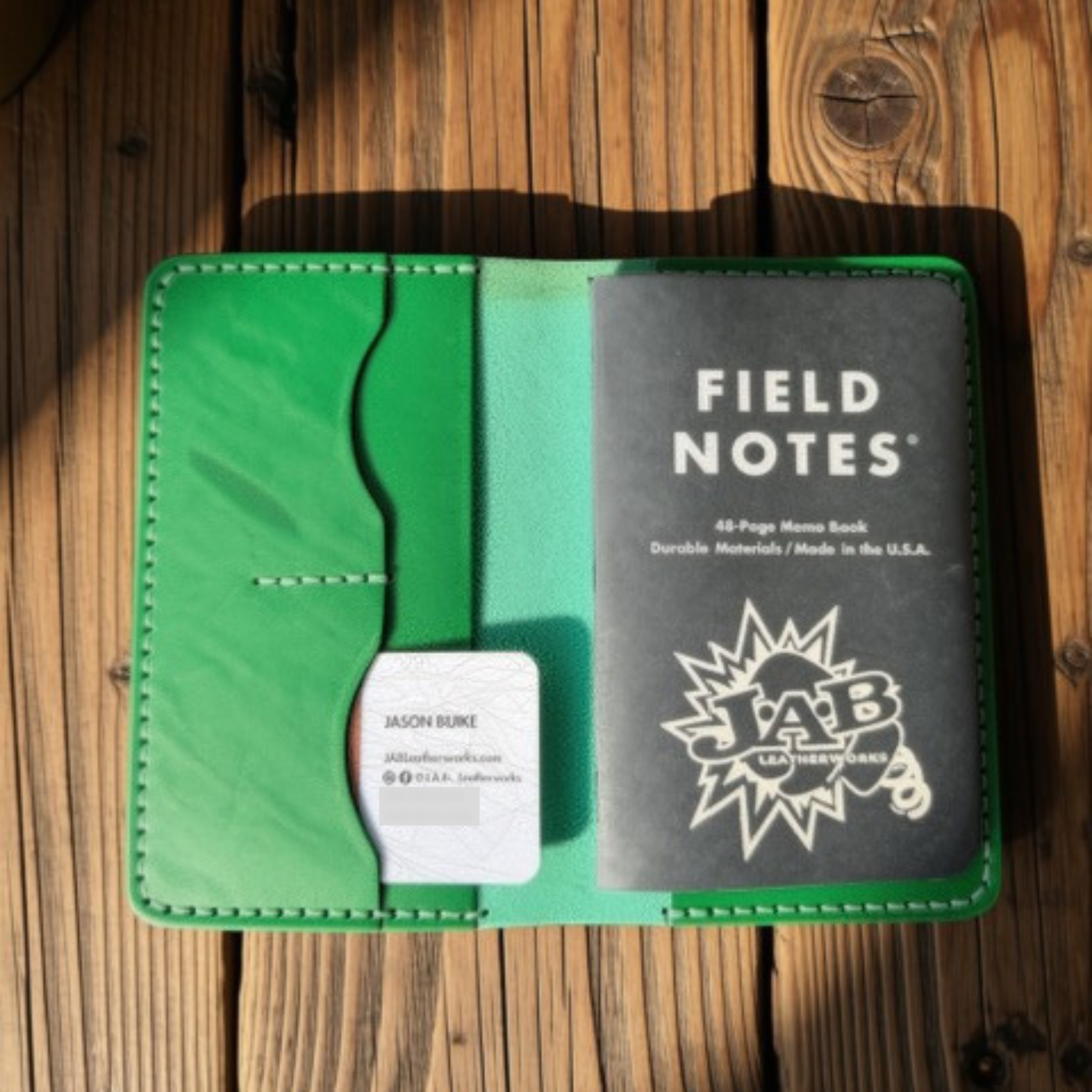 Open green Buttero leather Field Notes wallet with card slots and a notebook, handmade by JAB Leatherworks