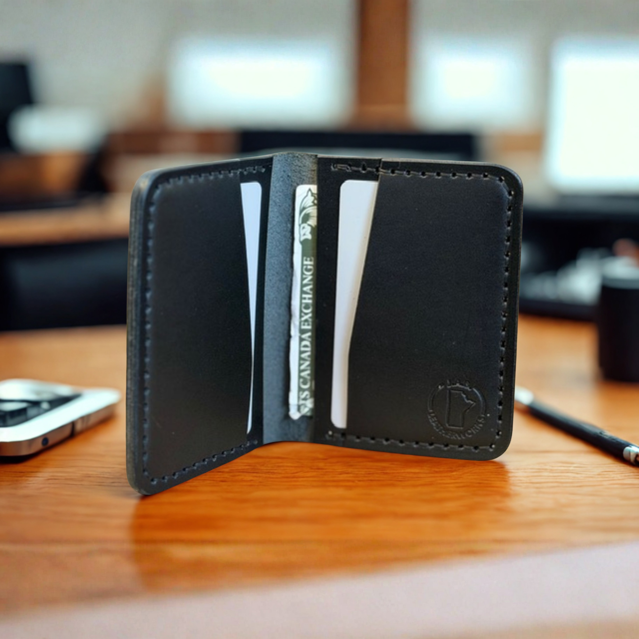 Premium full-grain leather bifold wallet with multiple card slots and cash compartment, handcrafted for durability