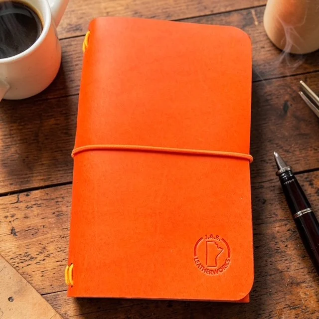 Handmade leather traveler’s notebook cover with refillable inserts