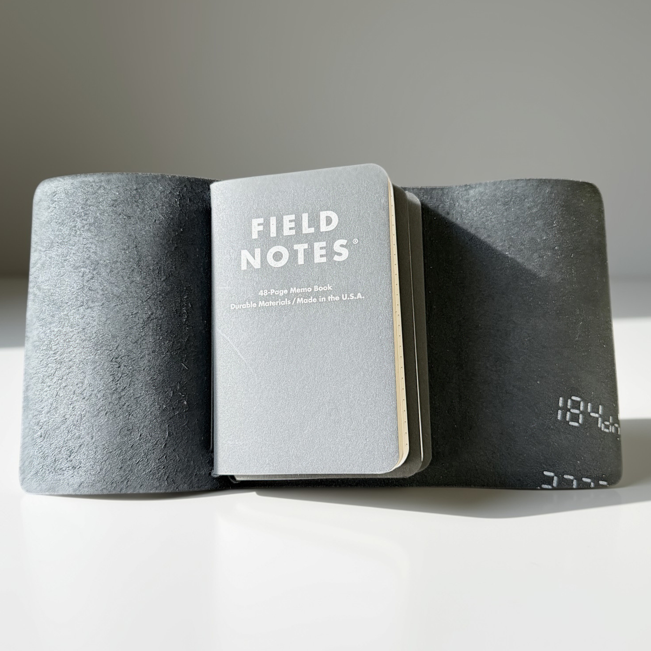 Black patent leather pocket Field Notes tri-fold cover, handmade by JAB Leatherworks