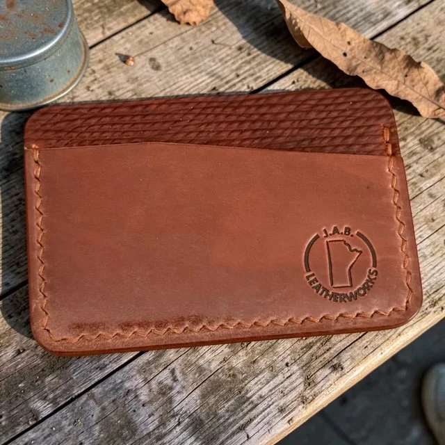 No. 47 cognac shell cordovan card holder with basket-weave texture by J.A.B. Leatherworks.