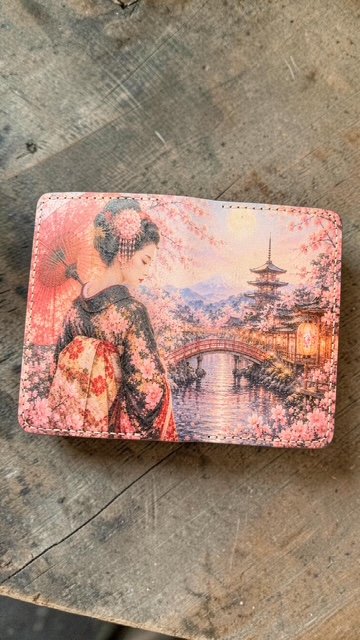 Full-grain leather Field Notes folio UV printed with a vibrant Japanese scene featuring a geisha, cherry blossoms, a pagoda, and a lantern-lit bridge,