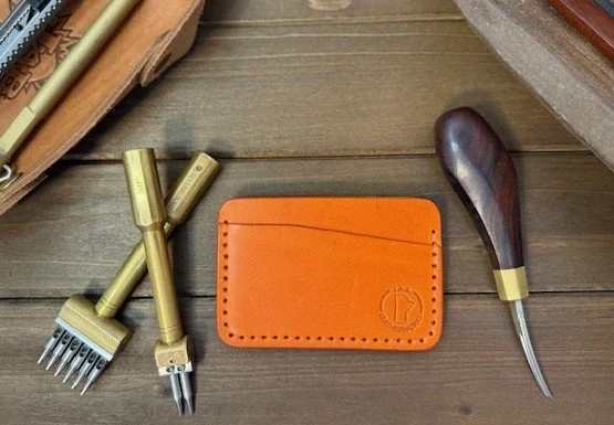 Full-grain leather horizontal card holder with sleek minimalist design, ideal for holding credit cards and ID.