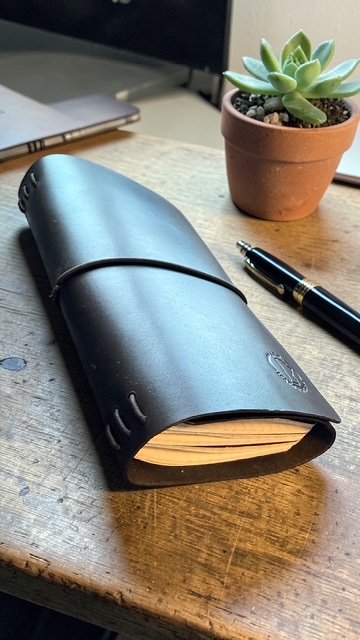 Handmade leather traveler’s notebook cover with refillable inserts
