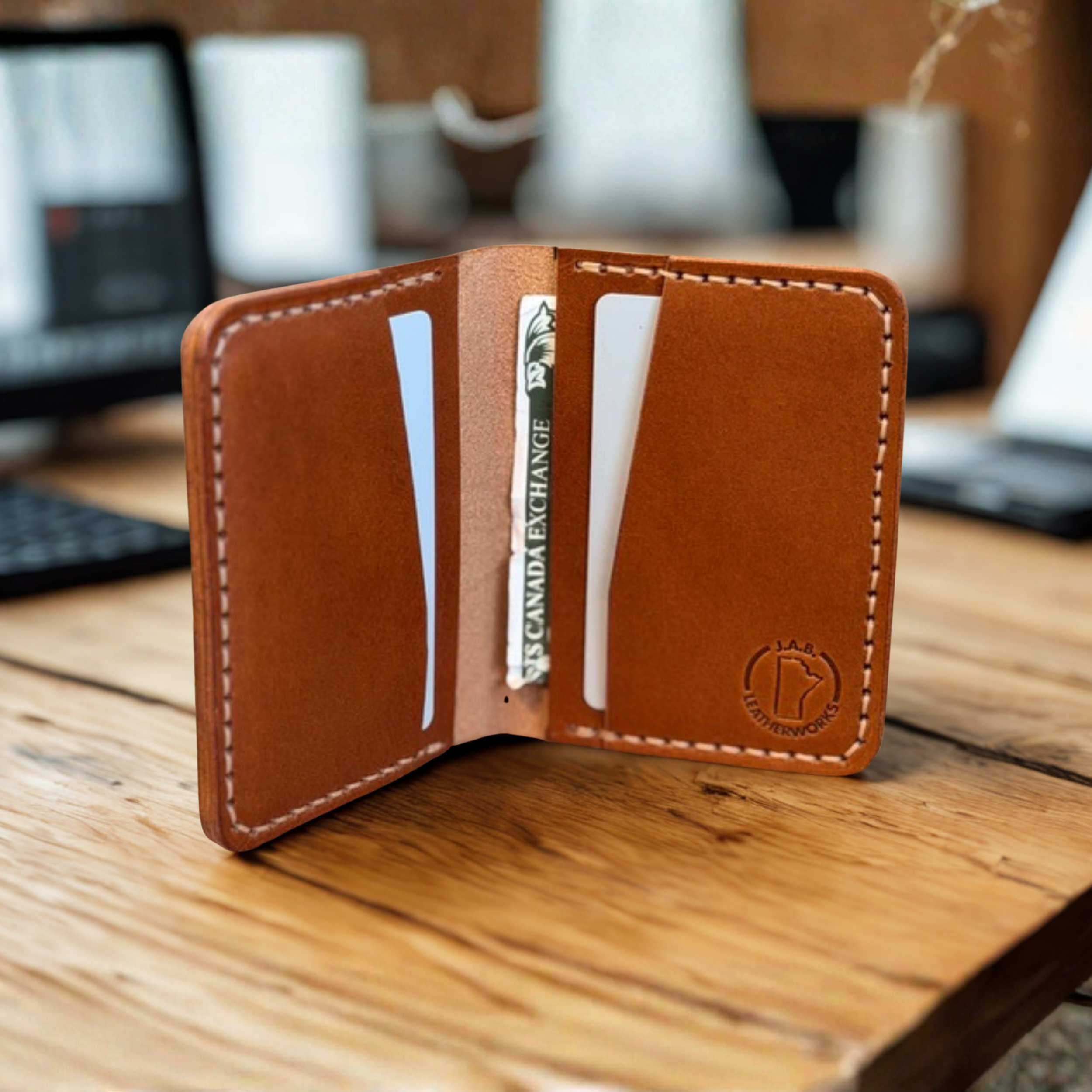 Premium full-grain leather bifold wallet with multiple card slots and cash compartment, handcrafted for durability