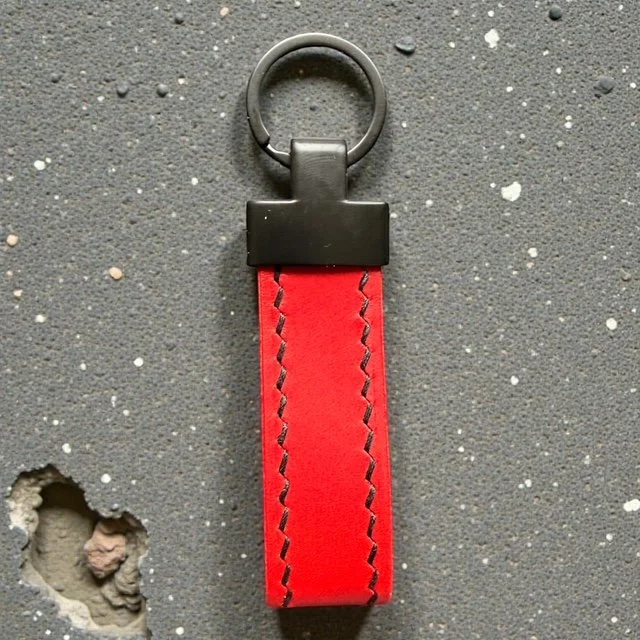 Handcrafted leather key loop for holding multiple keys securely, with simple and sleek design.