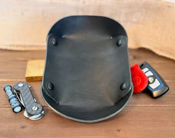 Handcrafted leather valet tray with stitched edges, perfect for holding keys, coins, and everyday essentials.