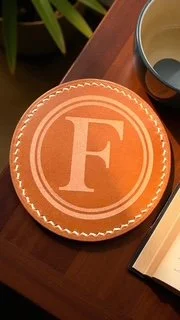 Personalized hand embossed full grain leather coaster with custom monogram, handcrafted in Canada