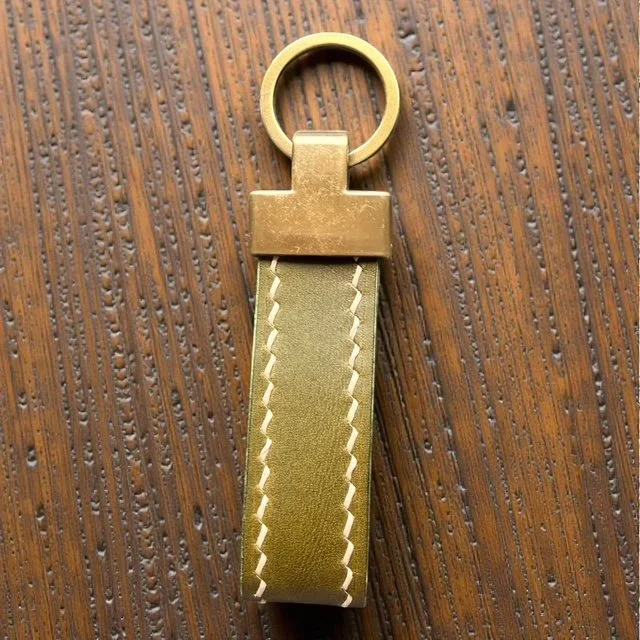 Handcrafted leather key loop for holding multiple keys securely, with simple and sleek design.