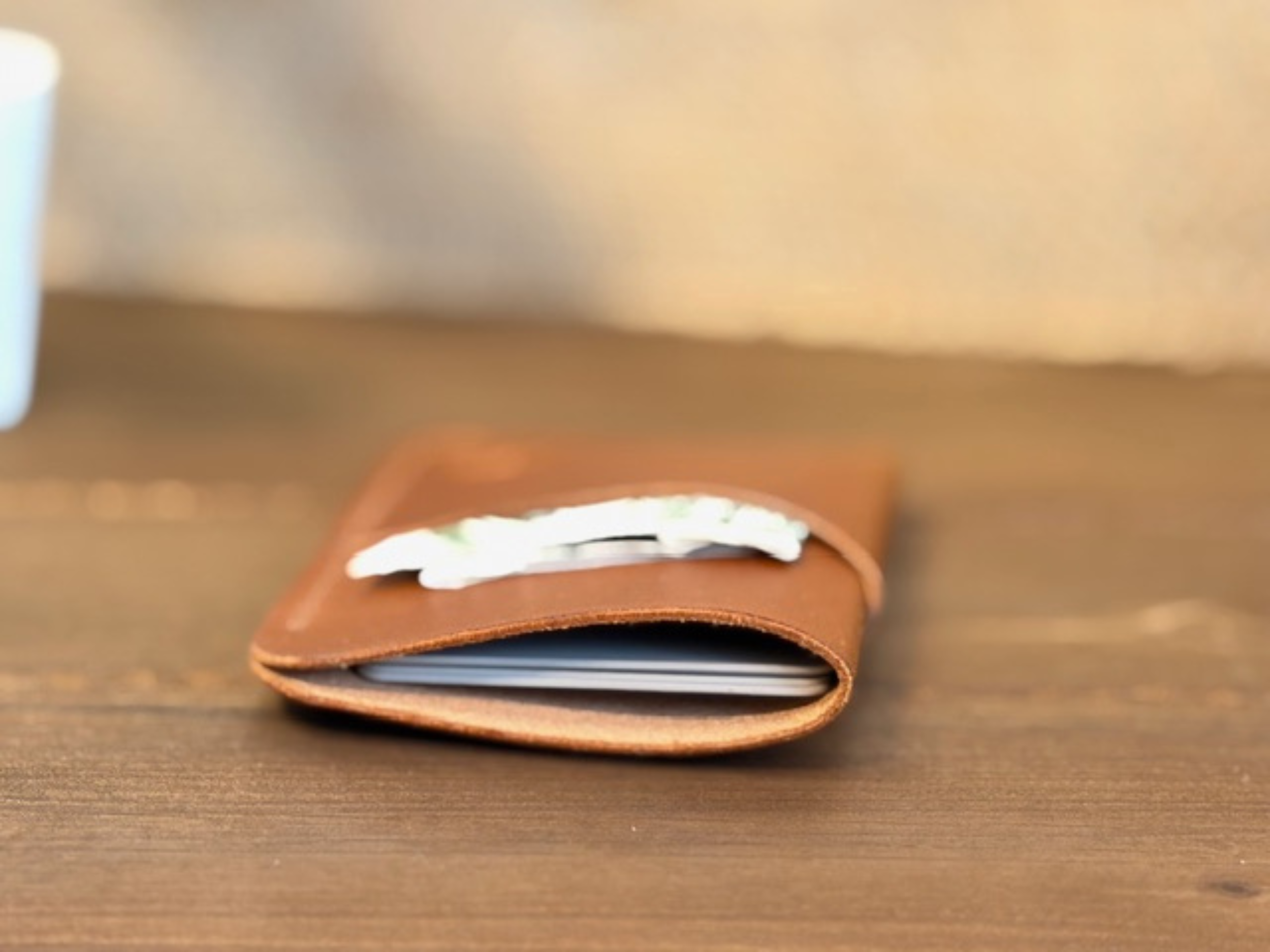 Handcrafted full-grain leather vertical card holder with slim, compact design for everyday carry.