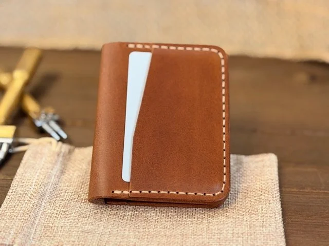 Premium full-grain leather bifold wallet with multiple card slots and cash compartment, handcrafted for durability