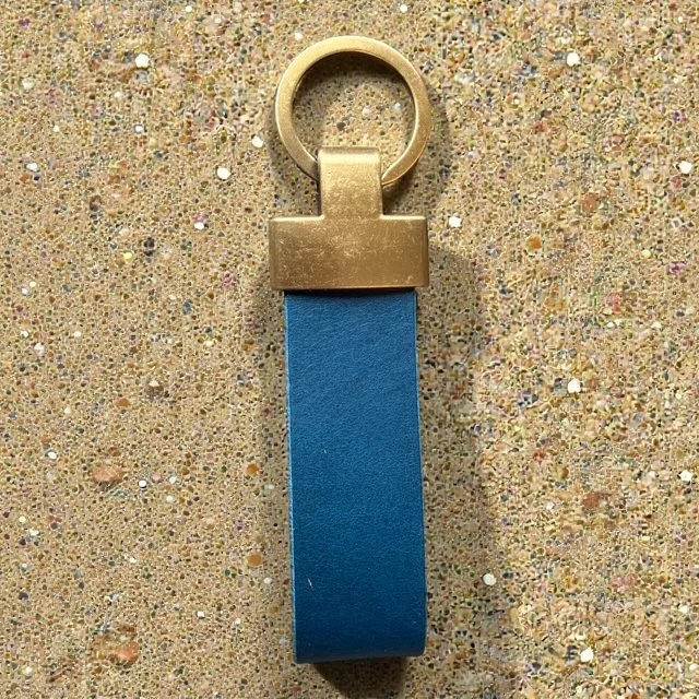 Handcrafted leather key loop for holding multiple keys securely, with simple and sleek design.