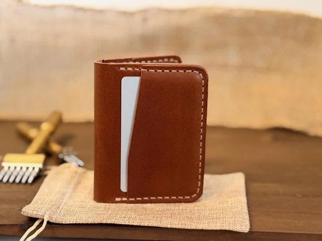 Premium full-grain leather bifold wallet with multiple card slots and cash compartment, handcrafted for durability