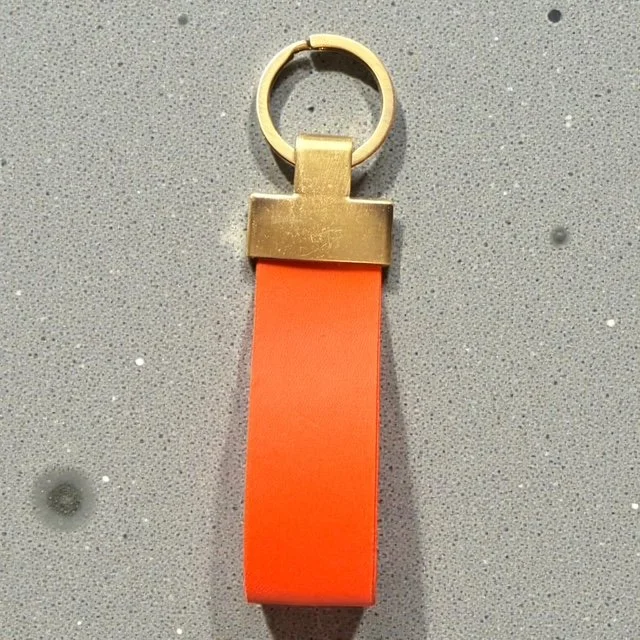 Handcrafted leather key loop for holding multiple keys securely, with simple and sleek design.