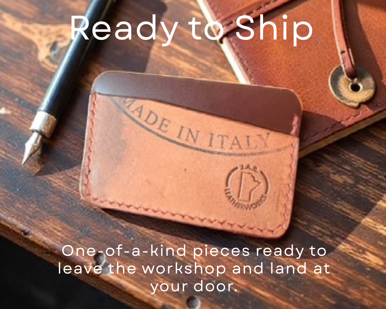 Leather wallet with "Made in Italy" stamp, wooden desk, fountain pen, brown leather notebook, indicating items are ready for shipment.