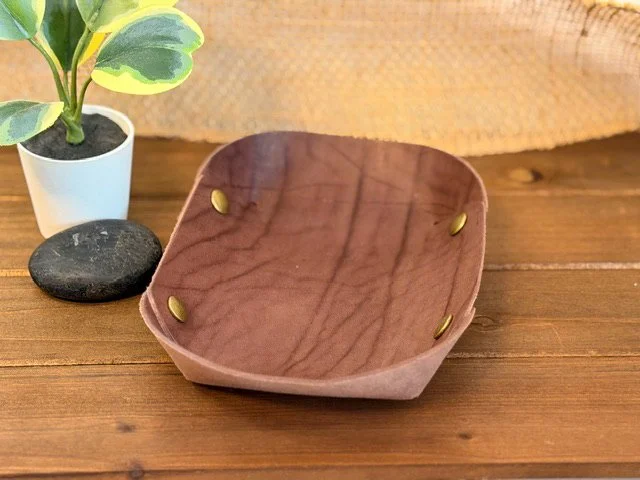 Handcrafted leather valet tray with stitched edges, perfect for holding keys, coins, and everyday essentials.