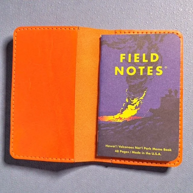 Full-grain leather folio designed for Field Notes notebooks, with interior pockets for pens and cards.
