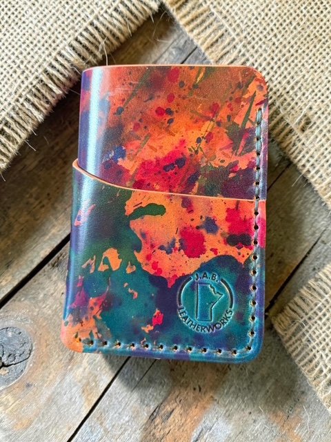 art shell cordovan vertical three-pocket card holder in teal, orange, red, and violet, handcrafted by J.A.B. Leatherworks, Canada.
