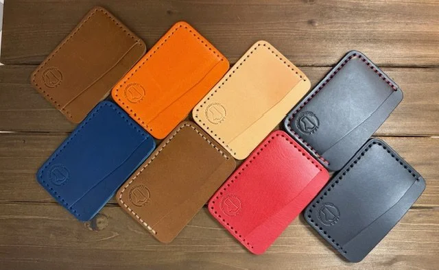 Full-grain leather horizontal card holder with sleek minimalist design, ideal for holding credit cards and ID.