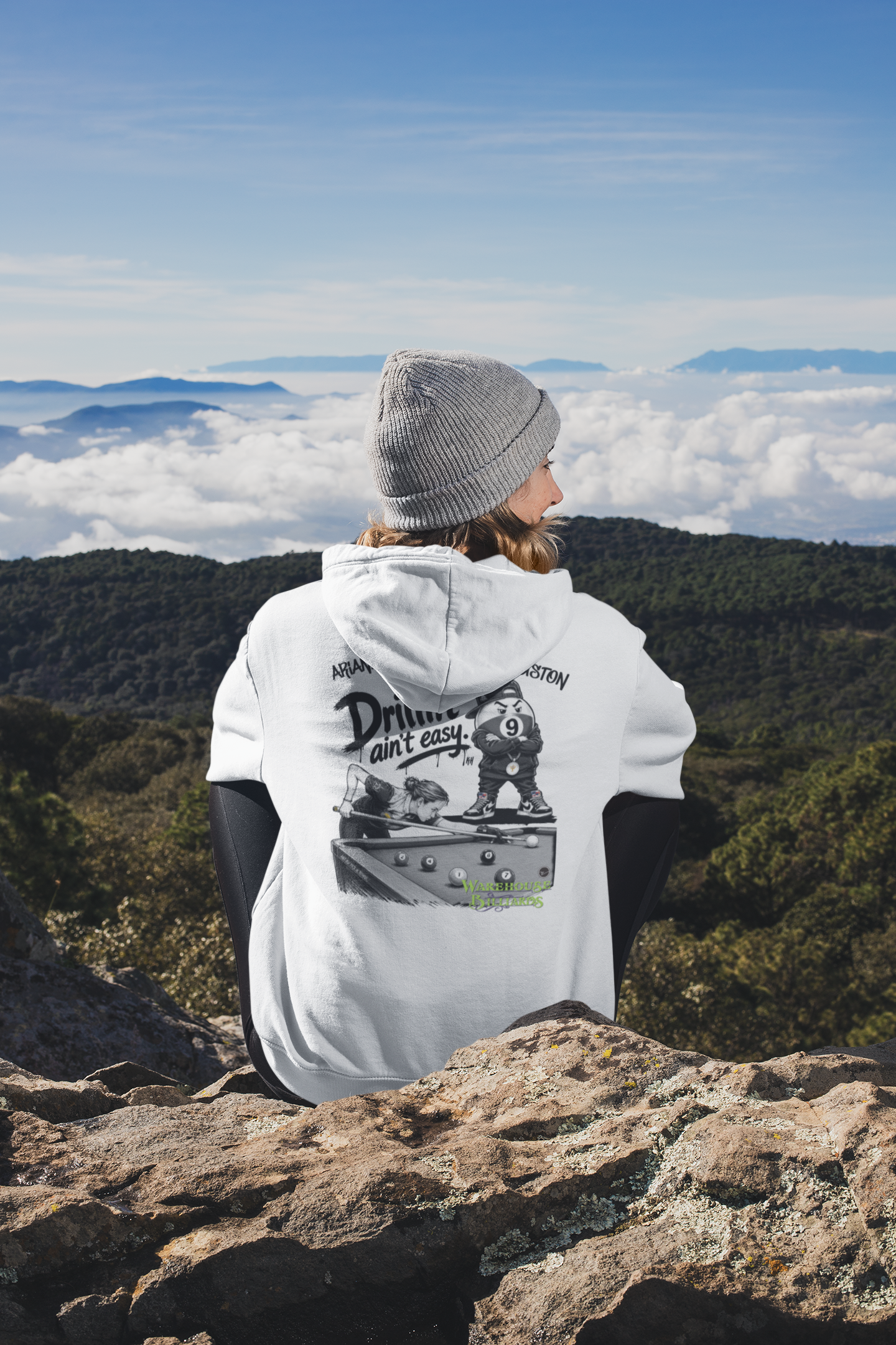 back-view-mockup-of-a-woman-wearing-a-hoodie-while-sitting-in-nature-30491.png