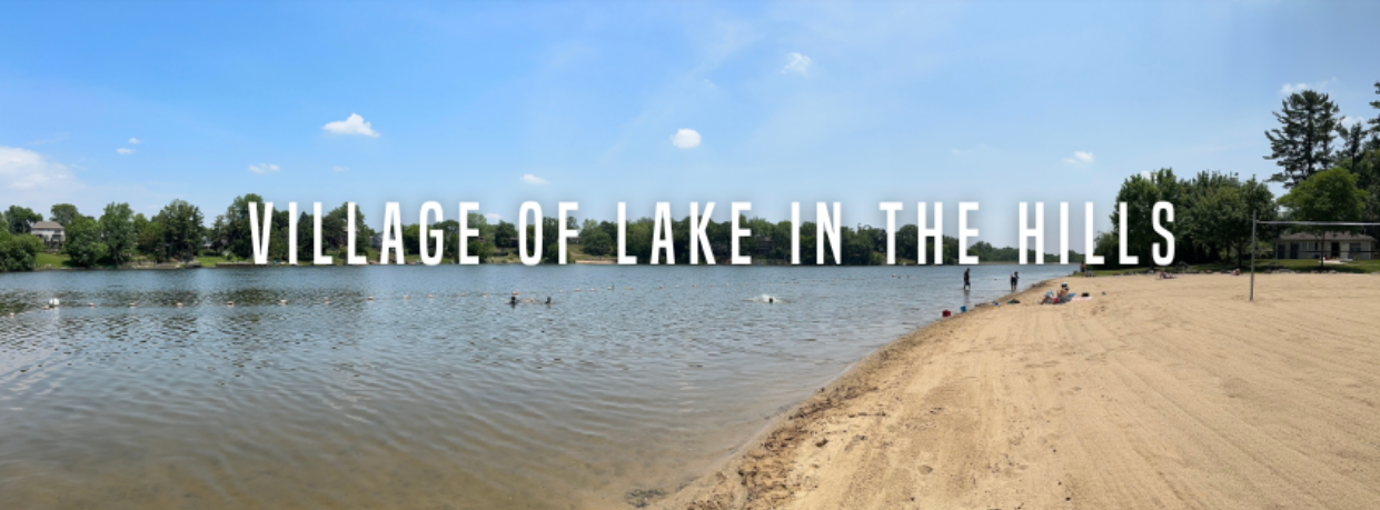 Sandy beach and swimmers on the lake in the Village of Lake in the Hills, Illinois, on a sunny summer day