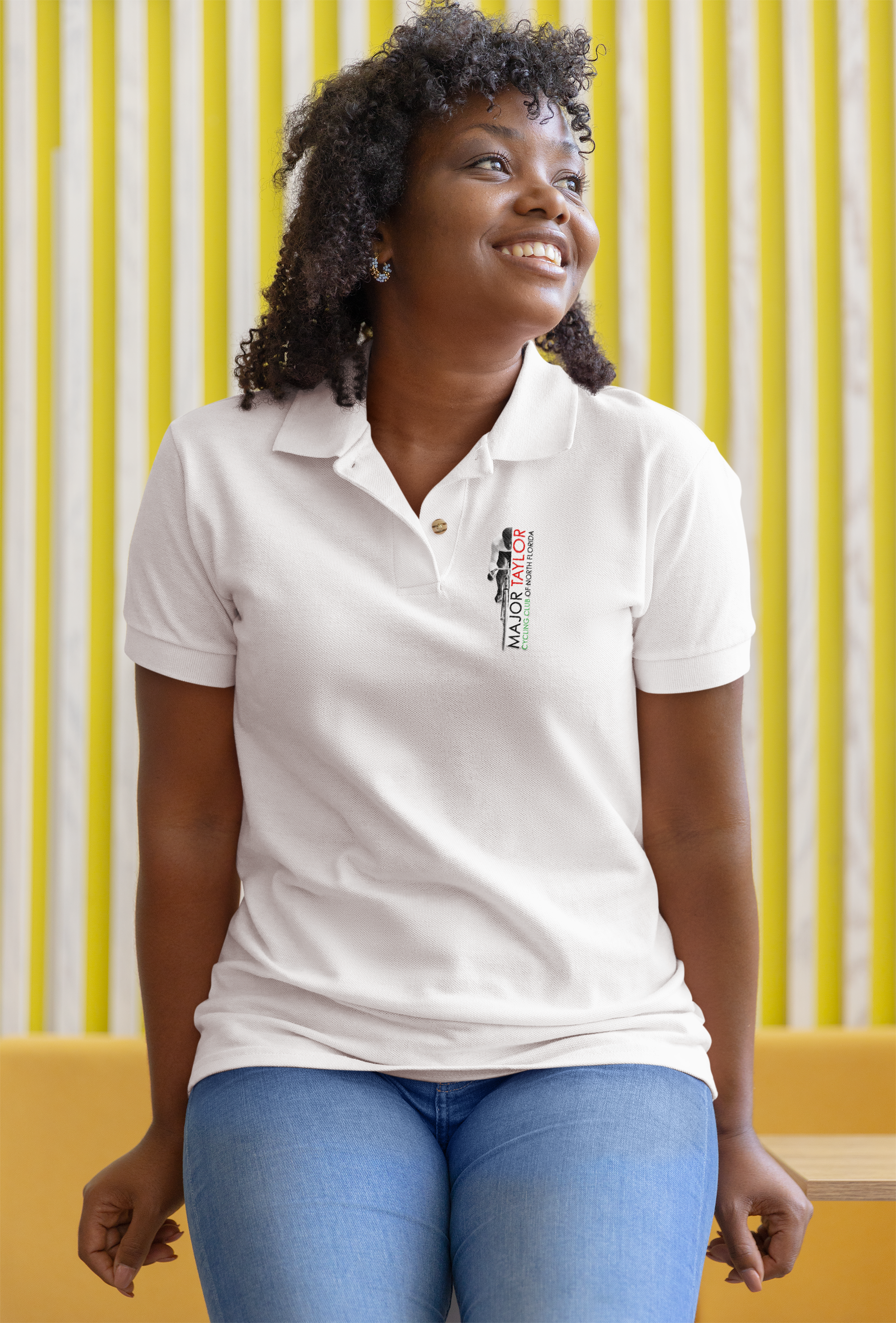 polo-shirt-mockup-featuring-a-curly-haired-woman-leaning-over-a-table-m34823 (1).png