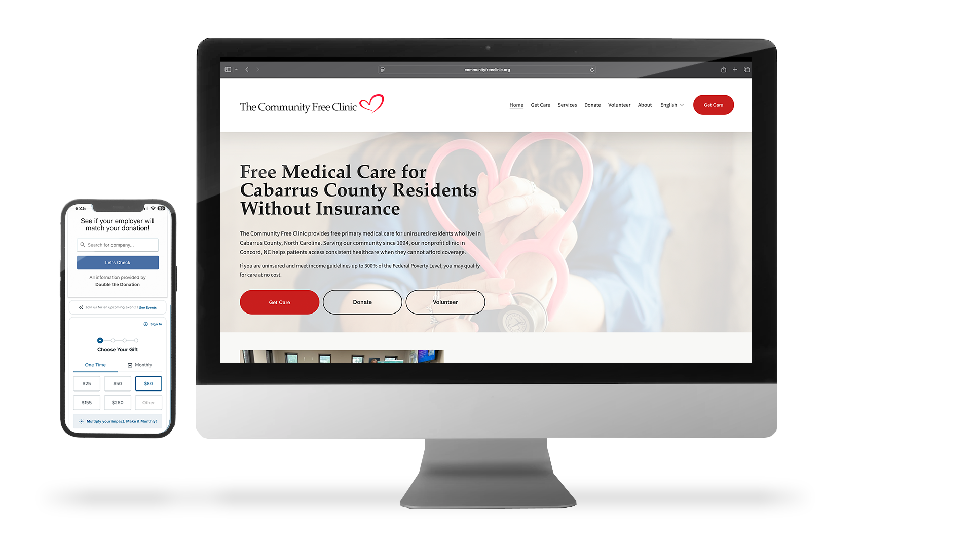 A computer monitor displaying a healthcare website for The Community Free Clinic, offering free medical care to residents of Cabarrus County, North Carolina, with a mobile phone showing a donation check interface.