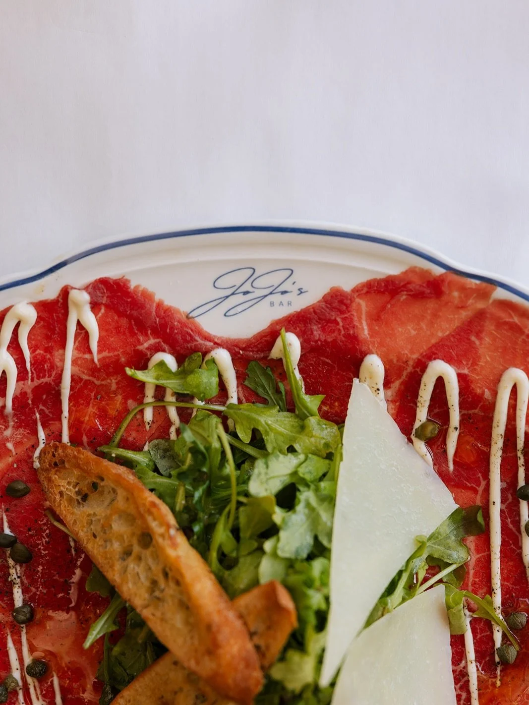 the first course debate: wagyu carpaccio or seafood tower?