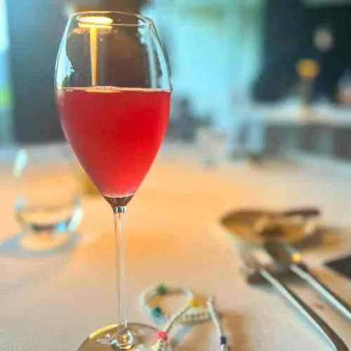 A glass of red soda at a restaurant in Lisbon Portugal
