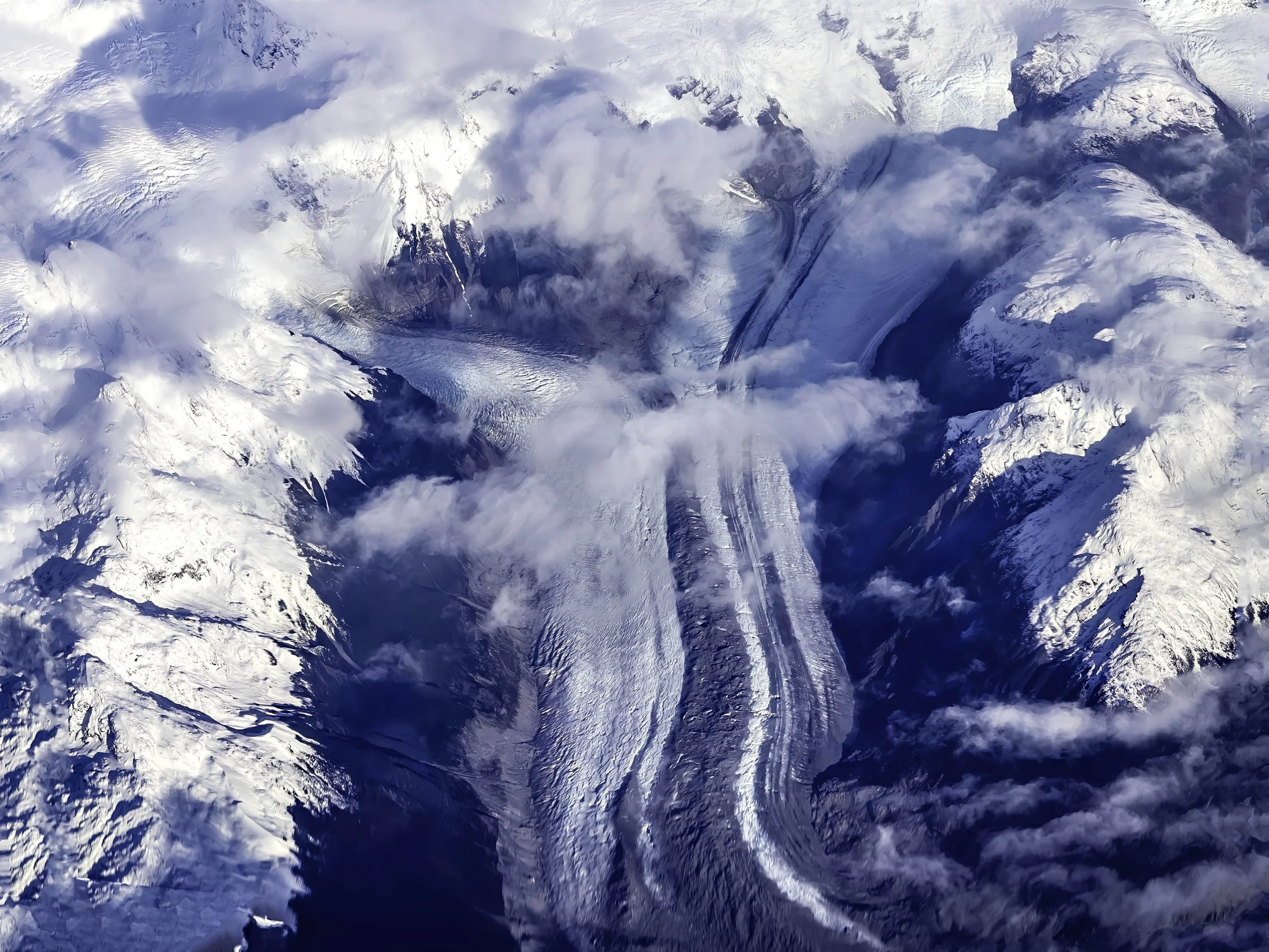 Chile • Patagonia • View of glacier strip between valleys and snow-topped mountains • Mar 19, 2024