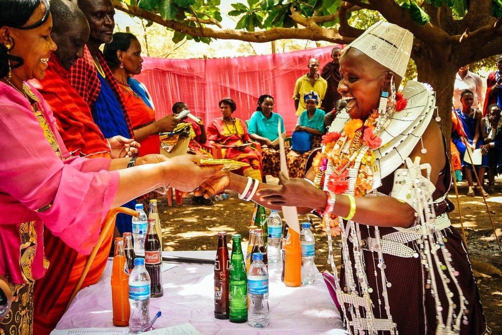 Joyful-Veronica-receives-a-gift-given-to-her-as-the-chairwoman-of-Namnyak-womens-group.jpg