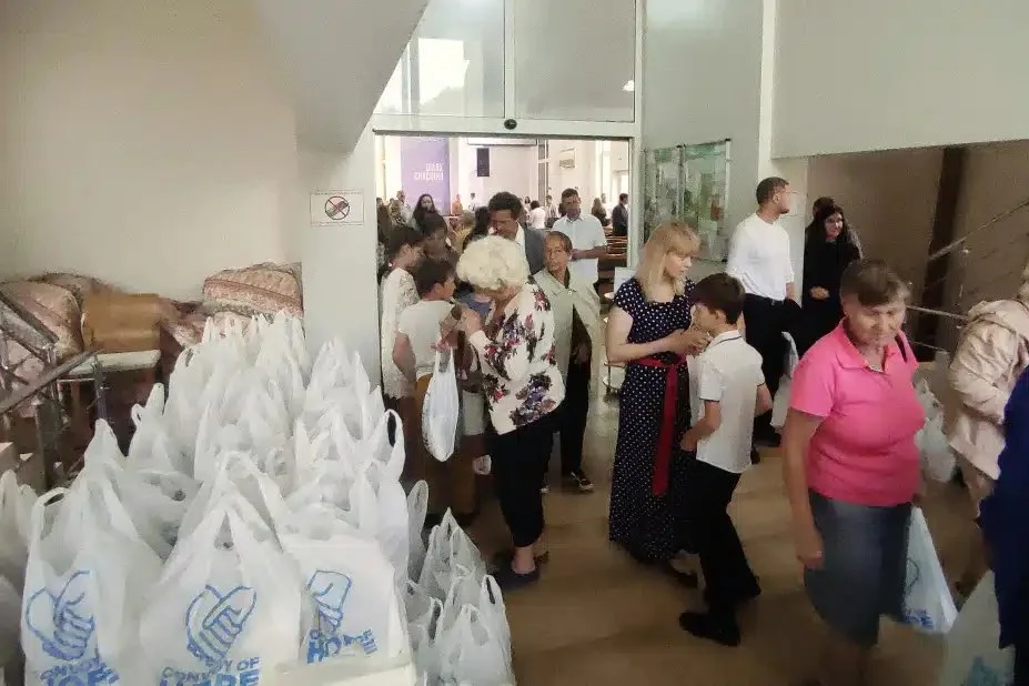   Ukrainians receive groceries provided by Convoy of Hope.  