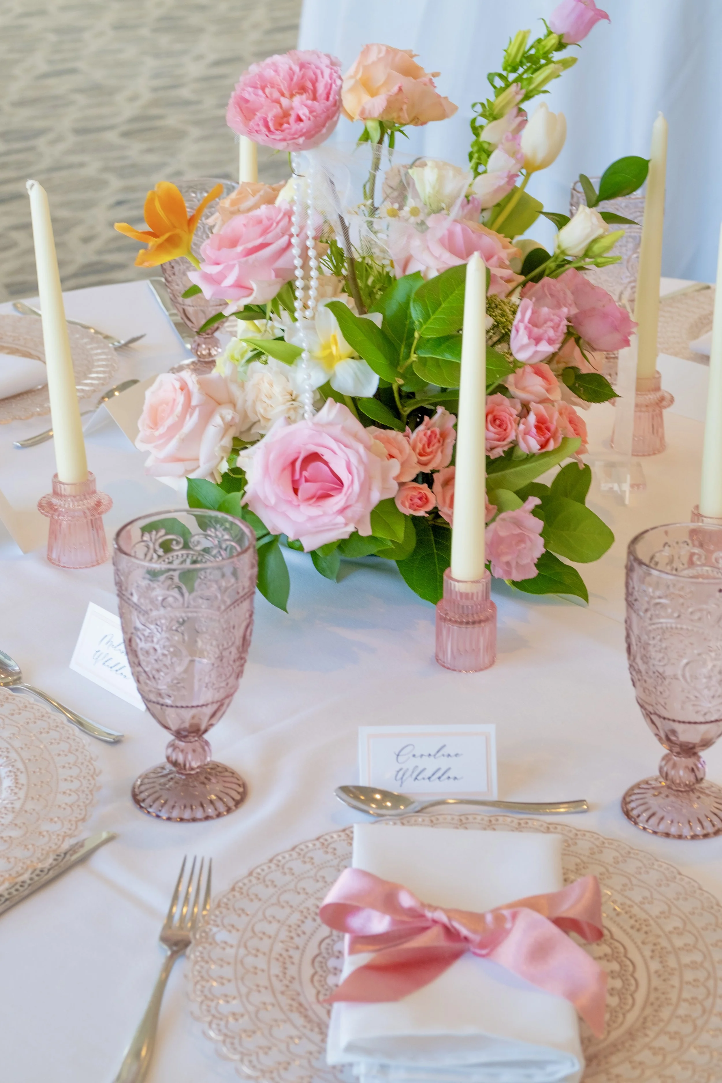 pink ribbon themed, loveshackfancy themed, birthday party, bridal shower, pink party, ribbon flower arch, pink table setting ideas