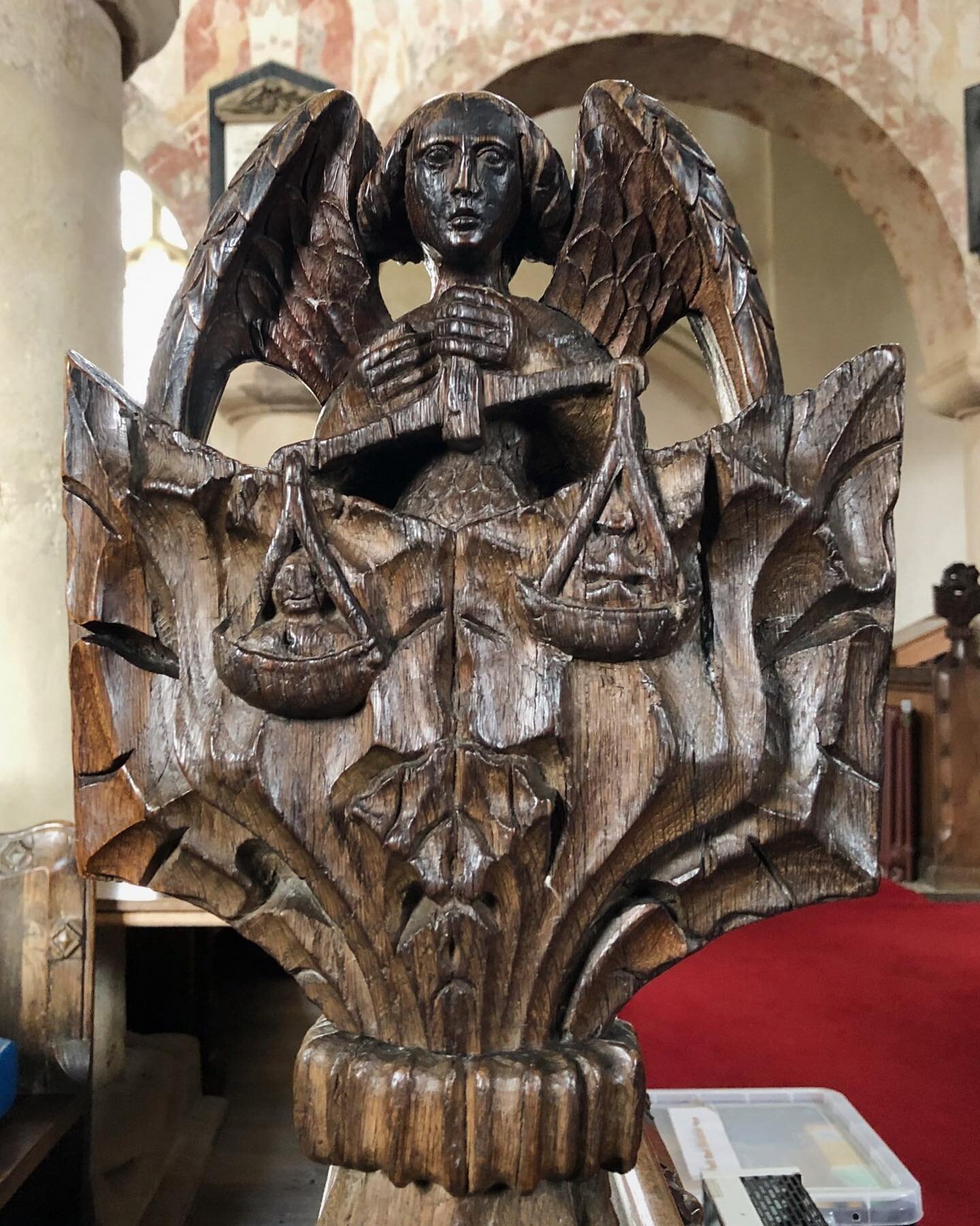 &bull; Ickleton, Cambridgeshire &bull;

An evocative scene and an insight into the medieval imagination. Here we see St Michael weighing the souls of the dead in a carved 15th century (I presume) bench end at St Mary Magdalene, Ickleton, Cambridgeshi