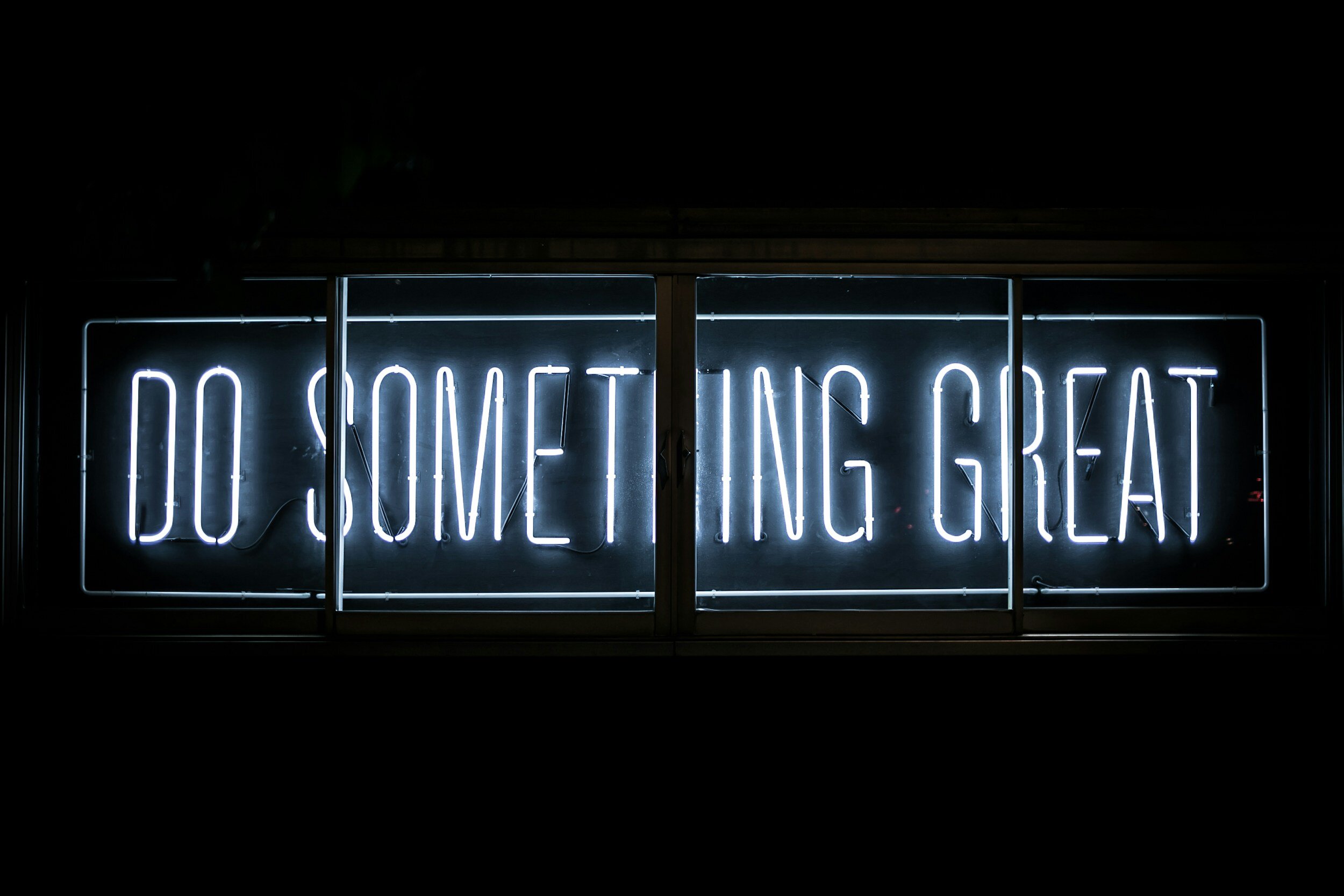 neon sing saying do something great