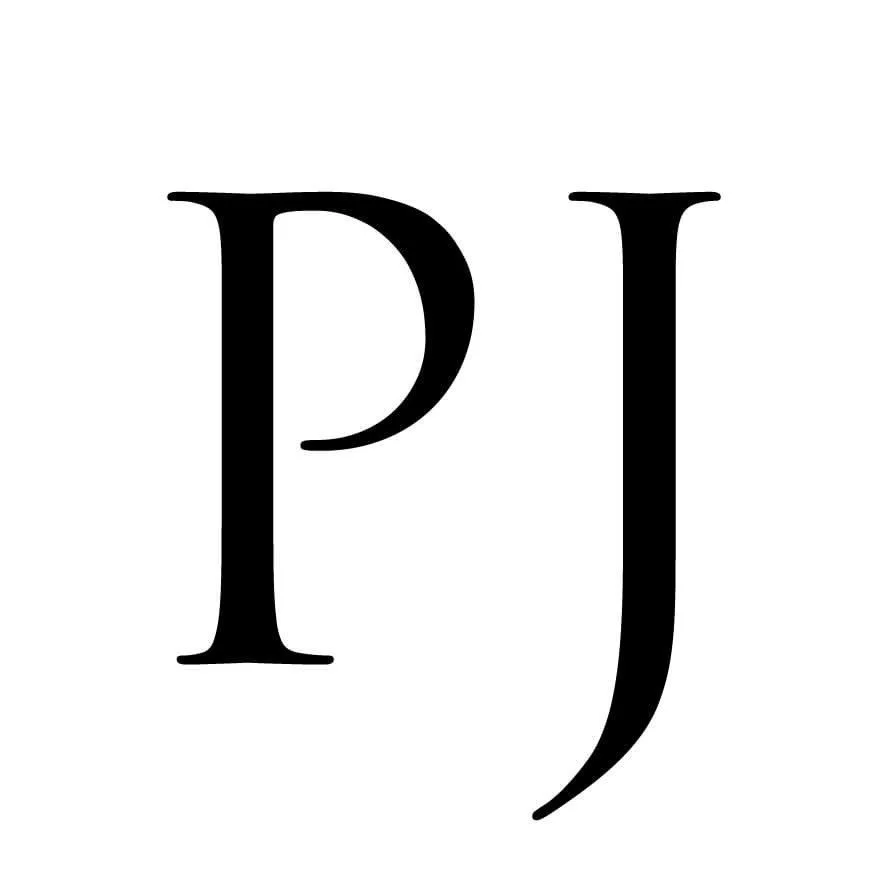 Close-up of stylized initials PJ in black on white background.