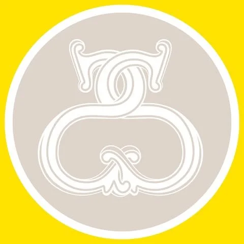 A stylized, white, line-art snake intertwined to form an infinity symbol, on a gray circular background with a yellow border.