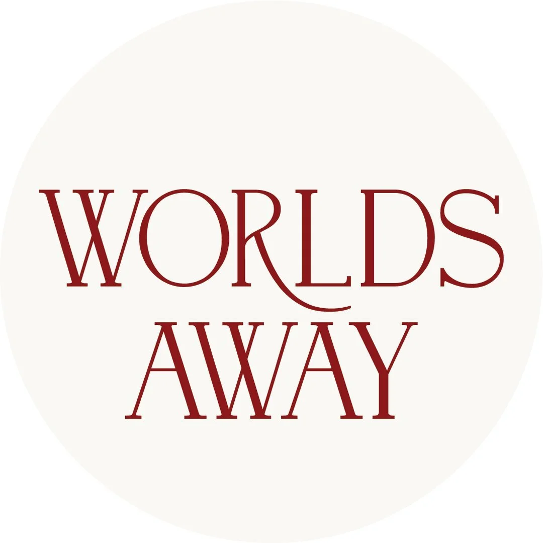 Text reading 'Worlds Away' in red letters on a white background