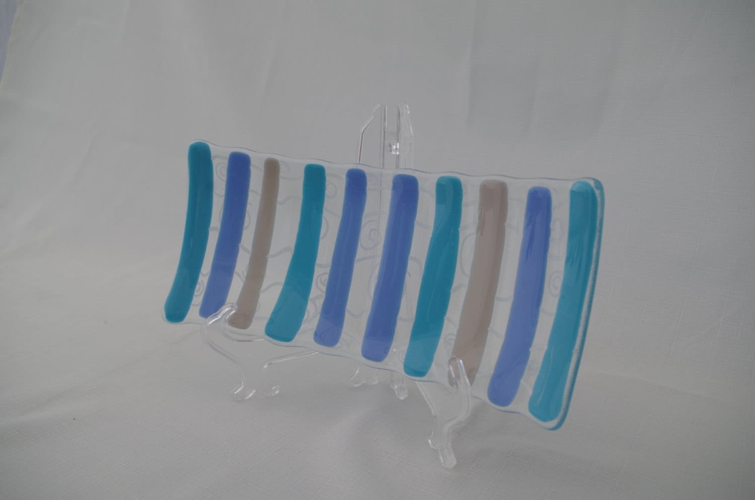 Fused sushi platter in clear and blue art glass.