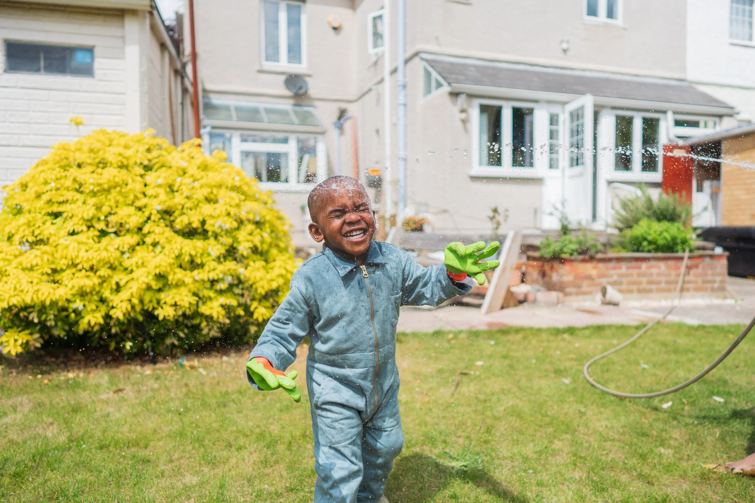 Iko-Ojo-Haruna_child-playing-in-sprinkler.jpg