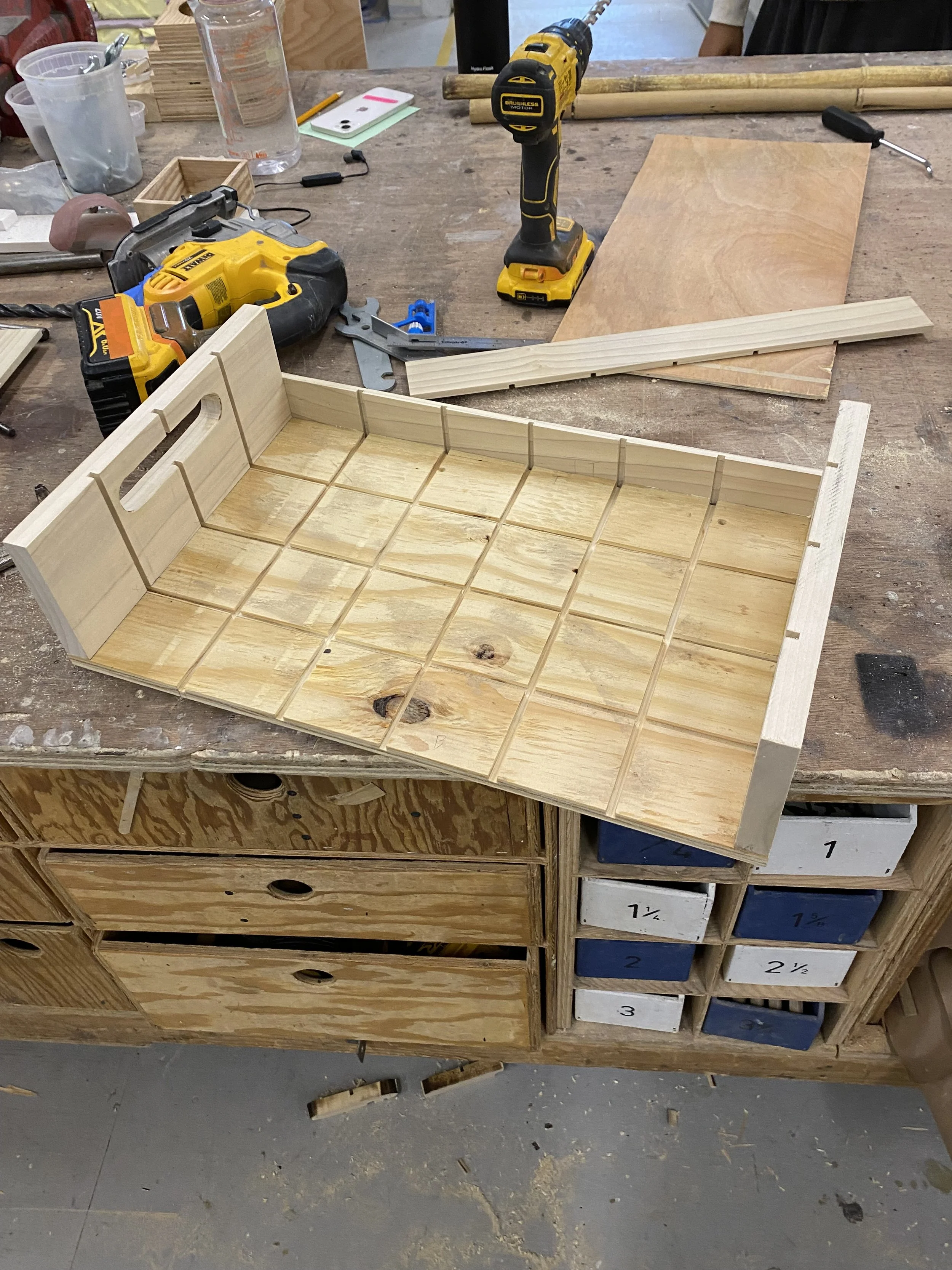 Crate construction in progress with grooves for dividers